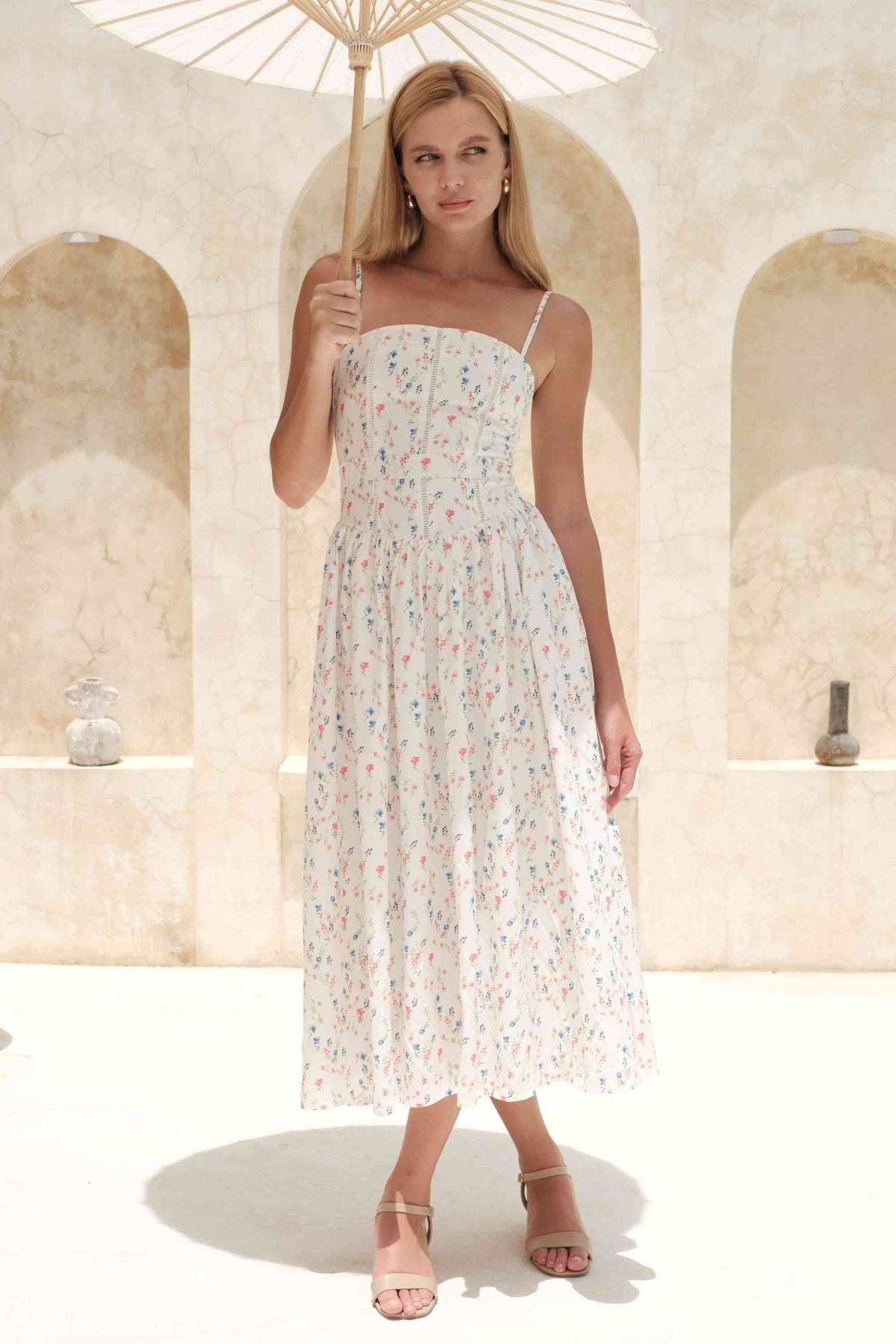 Woman wearing a figure flattering Tasmin Midi Dress - White Print BODYCON COLLECTION