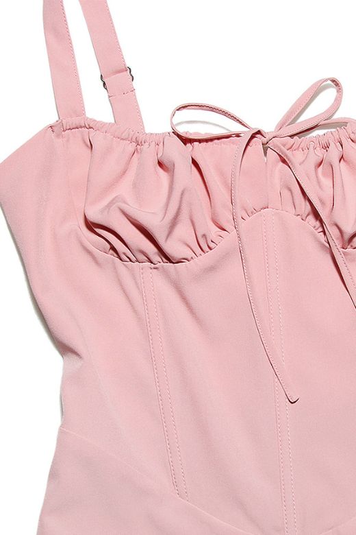 Woman wearing a figure flattering Taylor Bodycon Day Mini Dress - Dusty Pink BODYCON COLLECTION