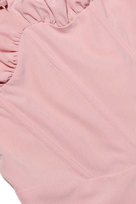 Woman wearing a figure flattering Taylor Bodycon Day Mini Dress - Dusty Pink BODYCON COLLECTION