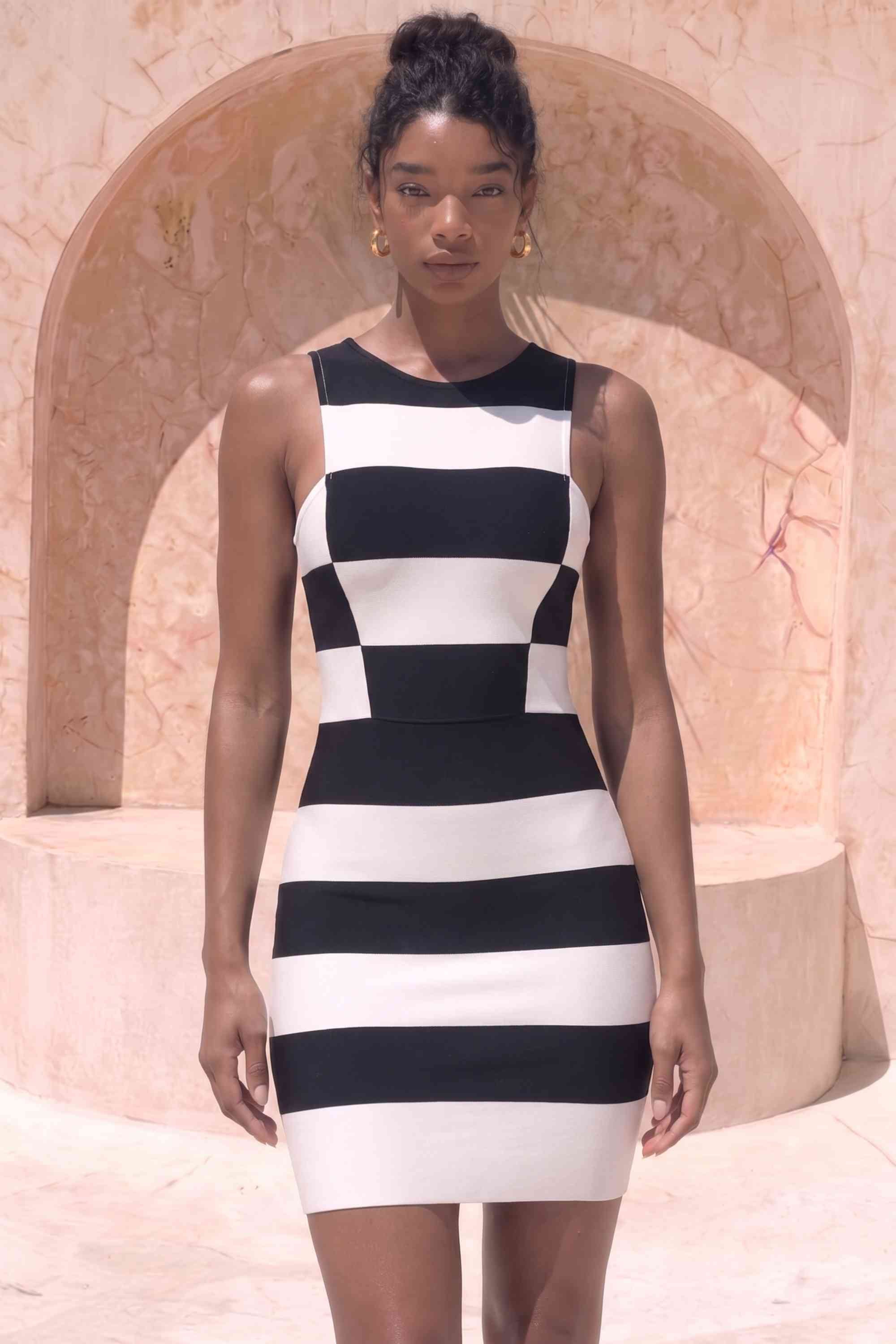 Woman wearing a figure flattering Veronica Bodycon Mini Dress - Classic Black BODYCON COLLECTION Pty Ltd