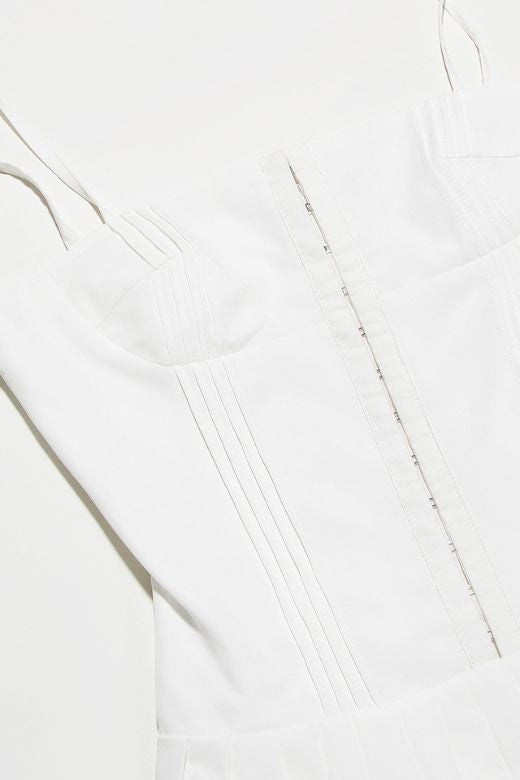 Woman wearing a figure flattering Vivien Bodycon Mini Dress - Pearl White BODYCON COLLECTION