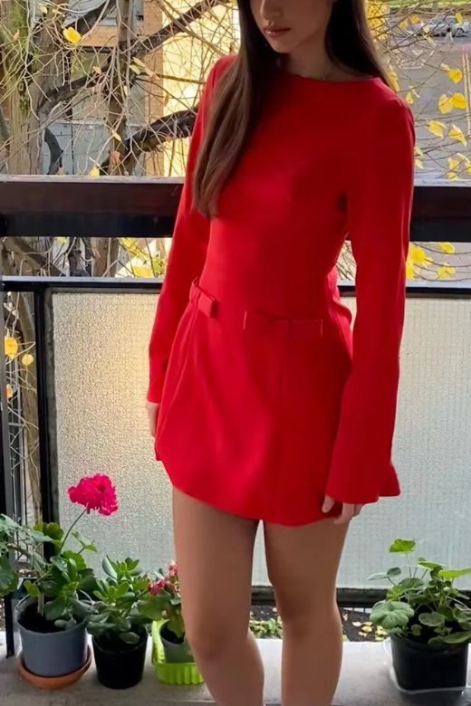 Woman wearing a figure flattering Zena Long Sleeve Bodycon Mini Dress - Lipstick Red BODYCON COLLECTION