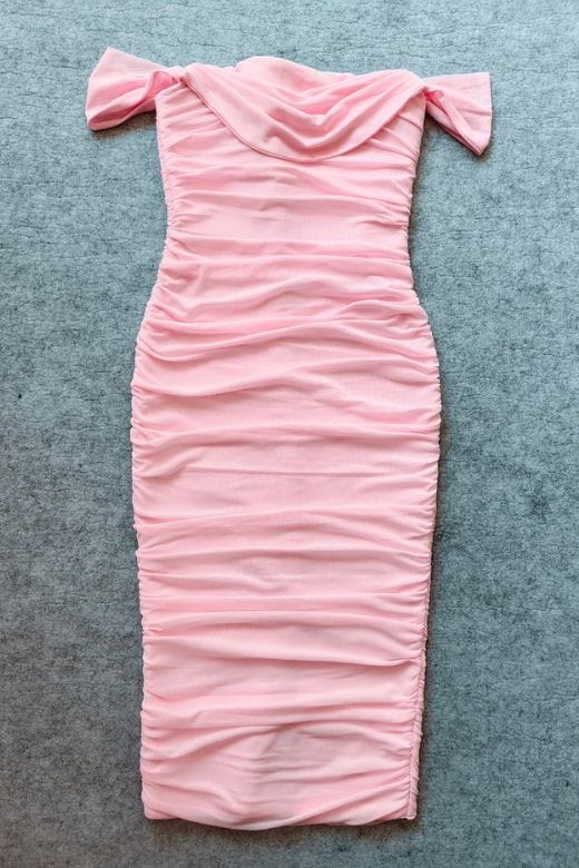 Woman wearing a figure flattering Zia Bodycon Wrap Midi Dress - Dusty Pink Bodycon Collection