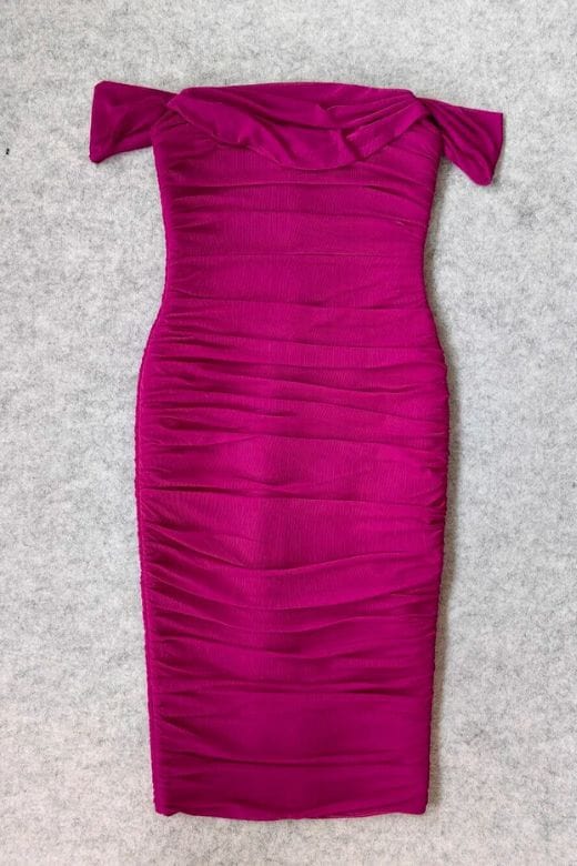 Woman wearing a figure flattering Zia Bodycon Wrap Midi Dress - Magenta Pink Bodycon Collection