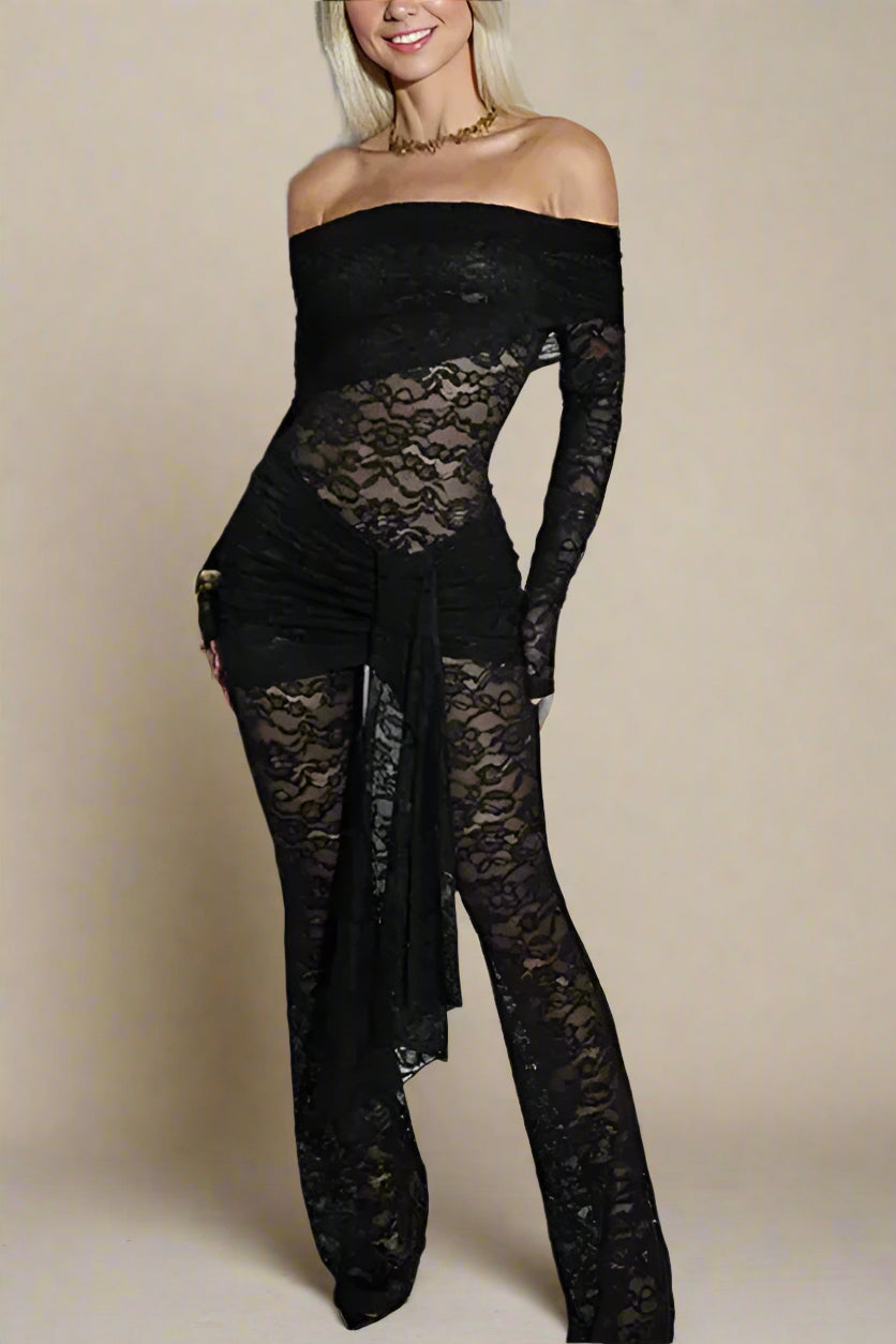 Woman wearing a figure flattering  Andie Long Sleeve Bodycon Wrap Jumpsuit - Classic Black BODYCON COLLECTION