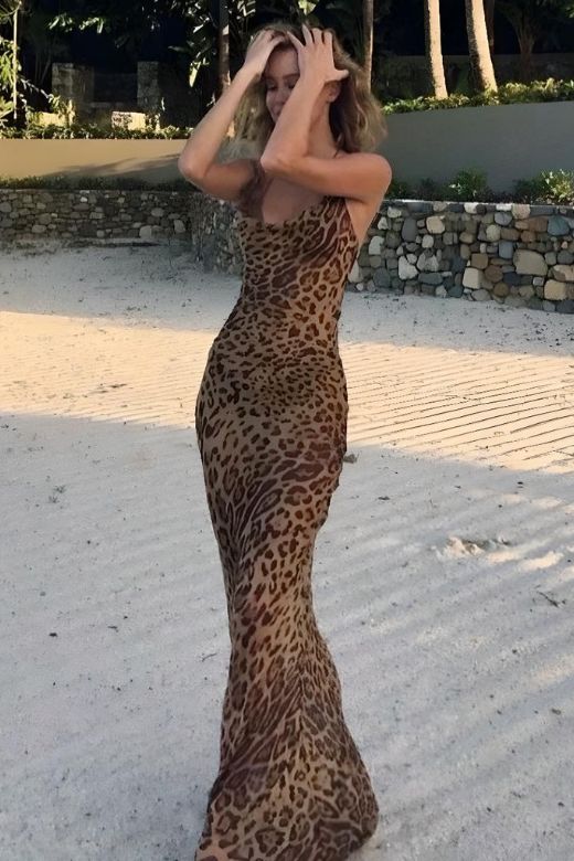 Woman wearing a figure flattering  Athena Bodycon Maxi Dress - Leopard Print Yellow BODYCON COLLECTION