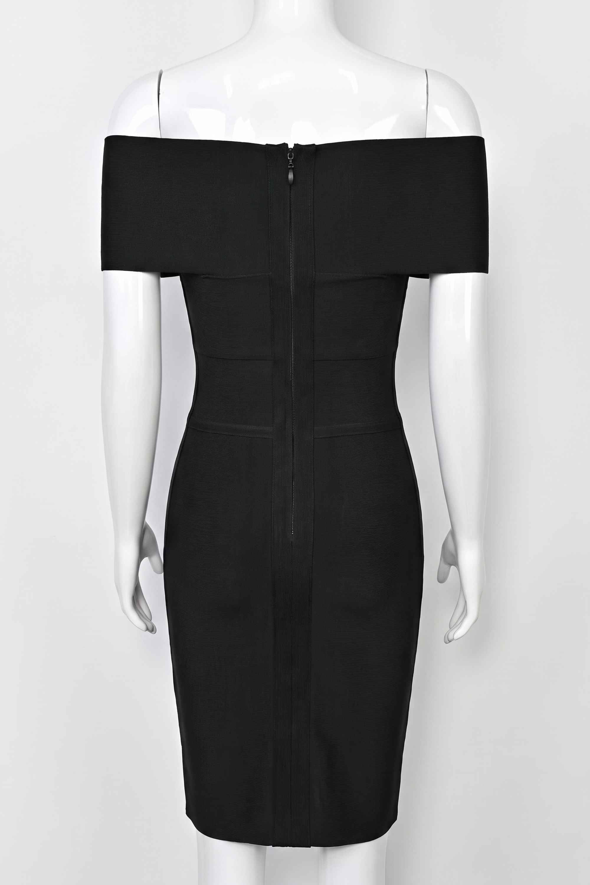 Woman wearing a figure flattering  Bea Bandage Dress - Classic Black Bodycon Collection