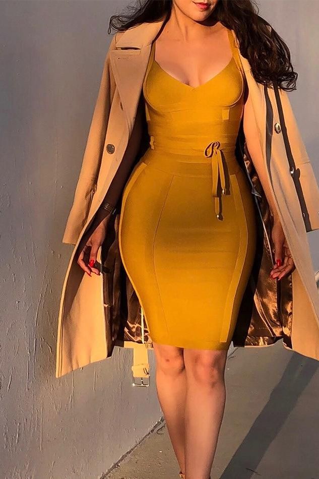 Woman wearing a figure flattering  Bek Bandage Dress - Mustard Yellow Bodycon Collection
