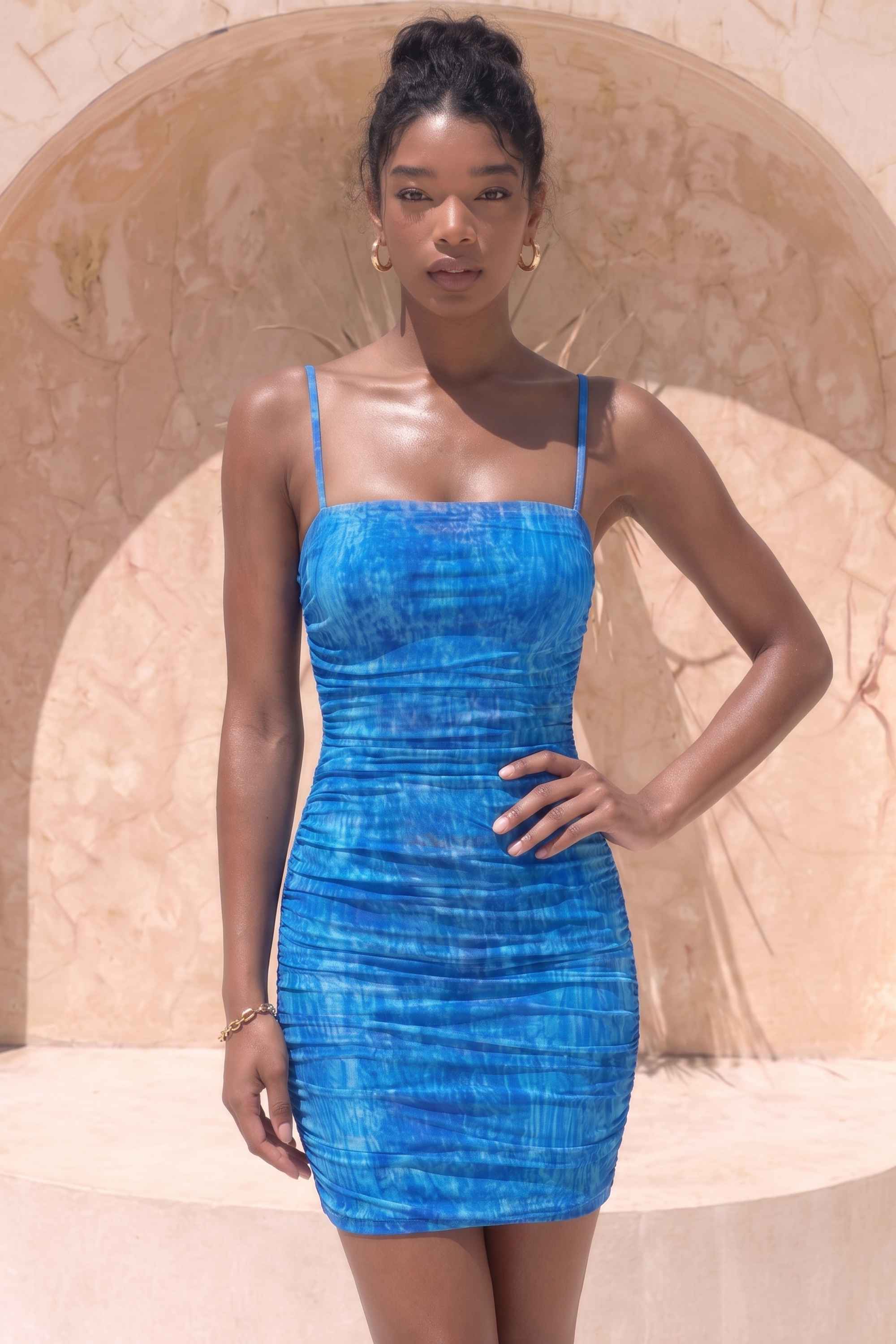 Woman wearing a figure flattering  Cassie Bodycon Wrap Mini Dress - Royal Blue BODYCON COLLECTION