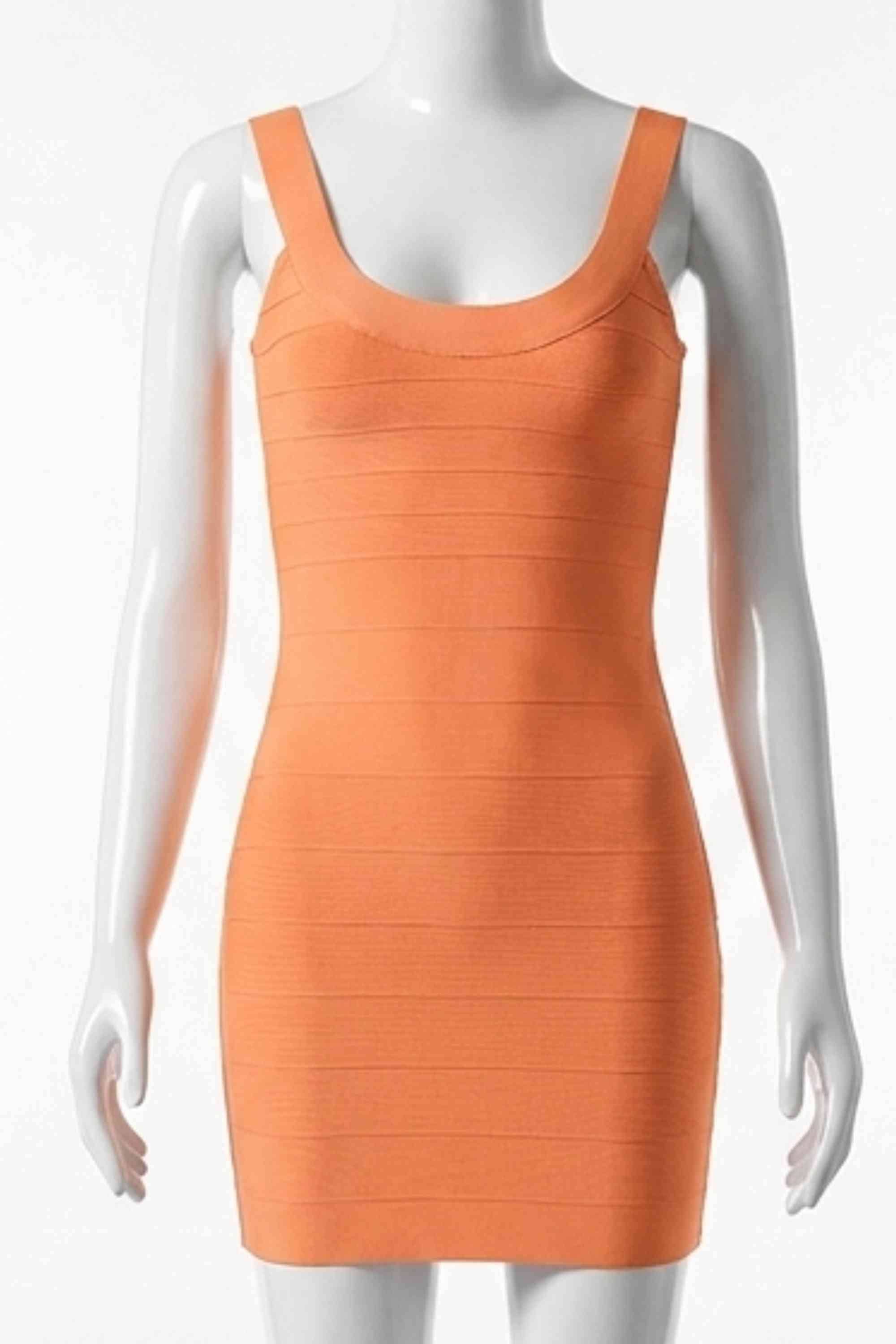 Woman wearing a figure flattering  Cindy Bandage Mini Dress - Apricot Orange BODYCON COLLECTION Pty Ltd