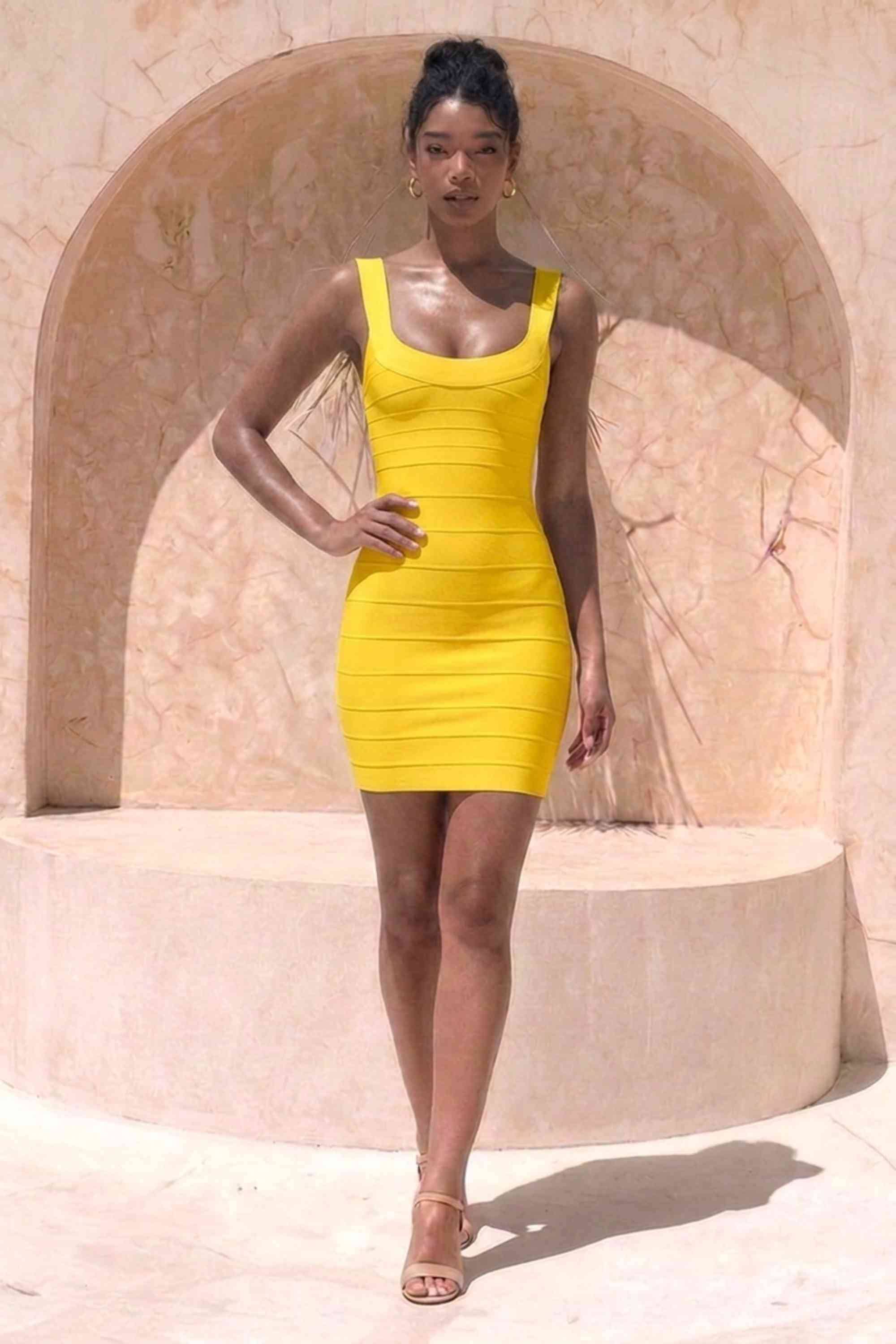 Woman wearing a figure flattering  Cindy Bandage Mini Dress - Mustard Yellow BODYCON COLLECTION Pty Ltd