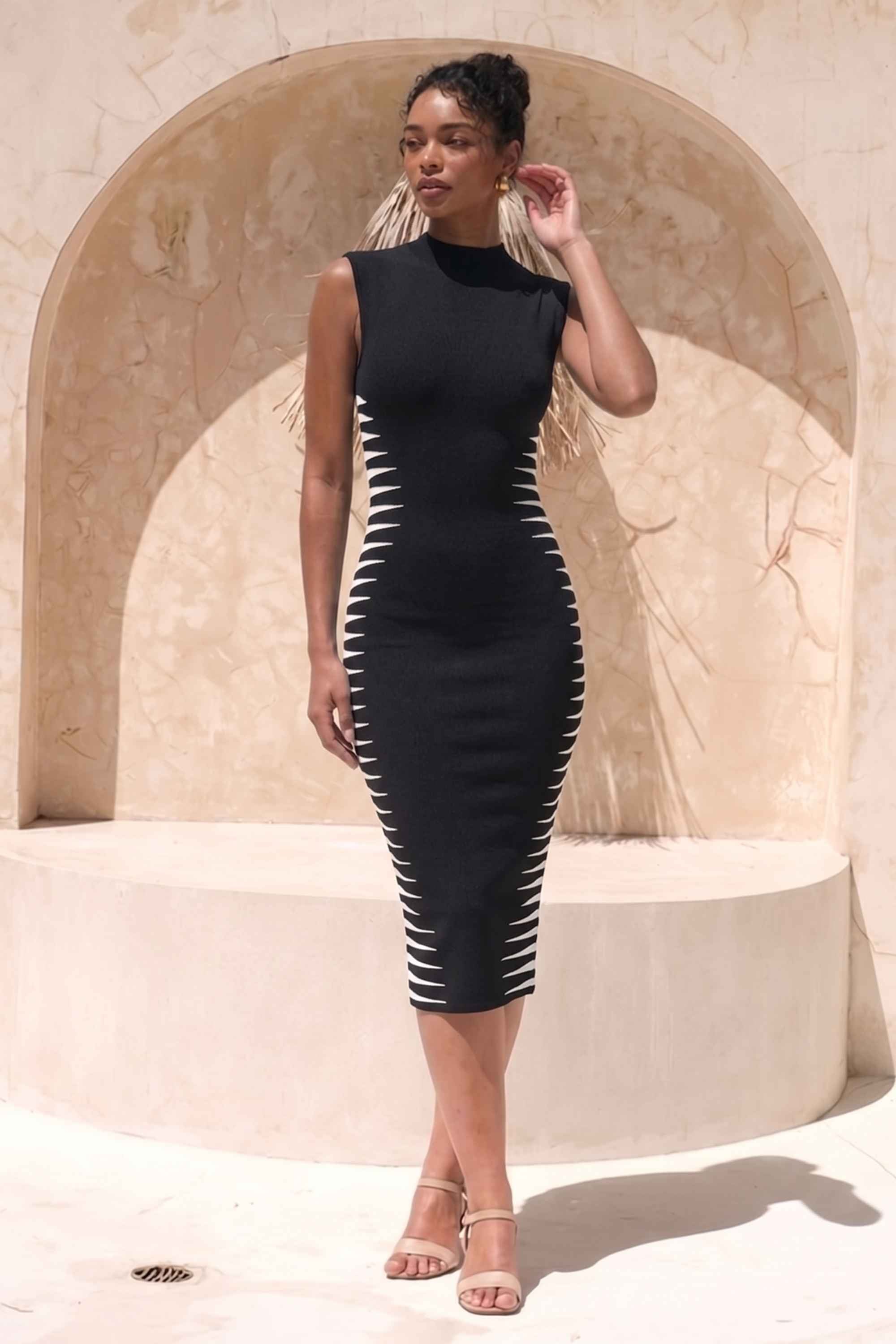 Woman wearing a figure flattering  Cleo Bandage Midi Dress - Classic Black BODYCON COLLECTION Pty Ltd