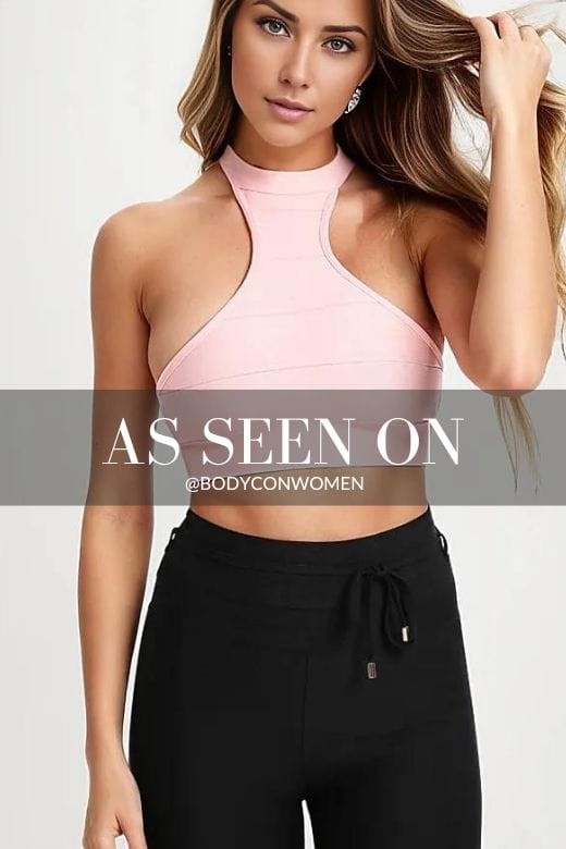 Woman wearing a figure flattering  Elli Bandage Crop Top - Dusty Pink BODYCON COLLECTION