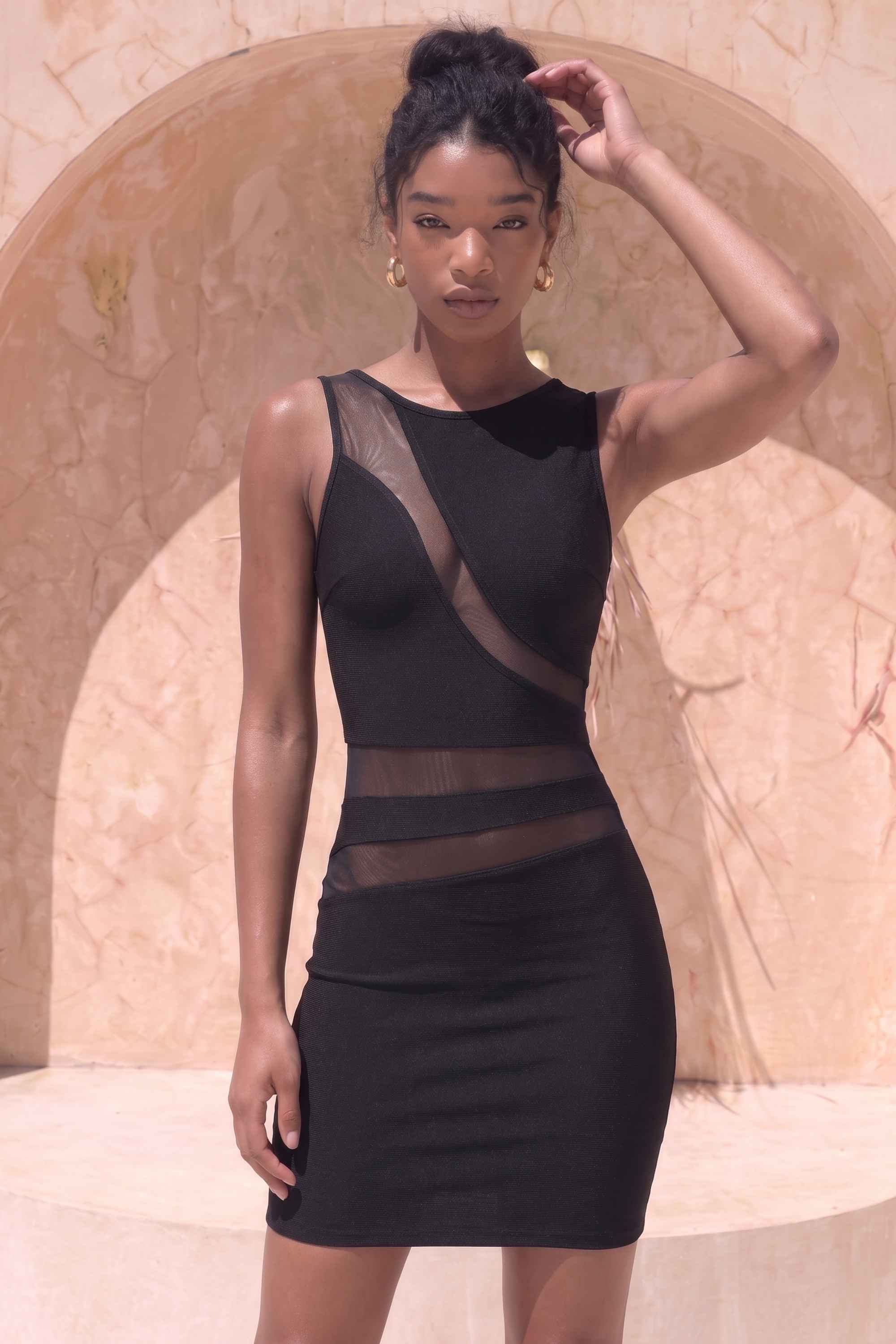 Woman wearing a figure flattering  Ellie Bodycon Mini Dress - Classic Black BODYCON COLLECTION Pty Ltd