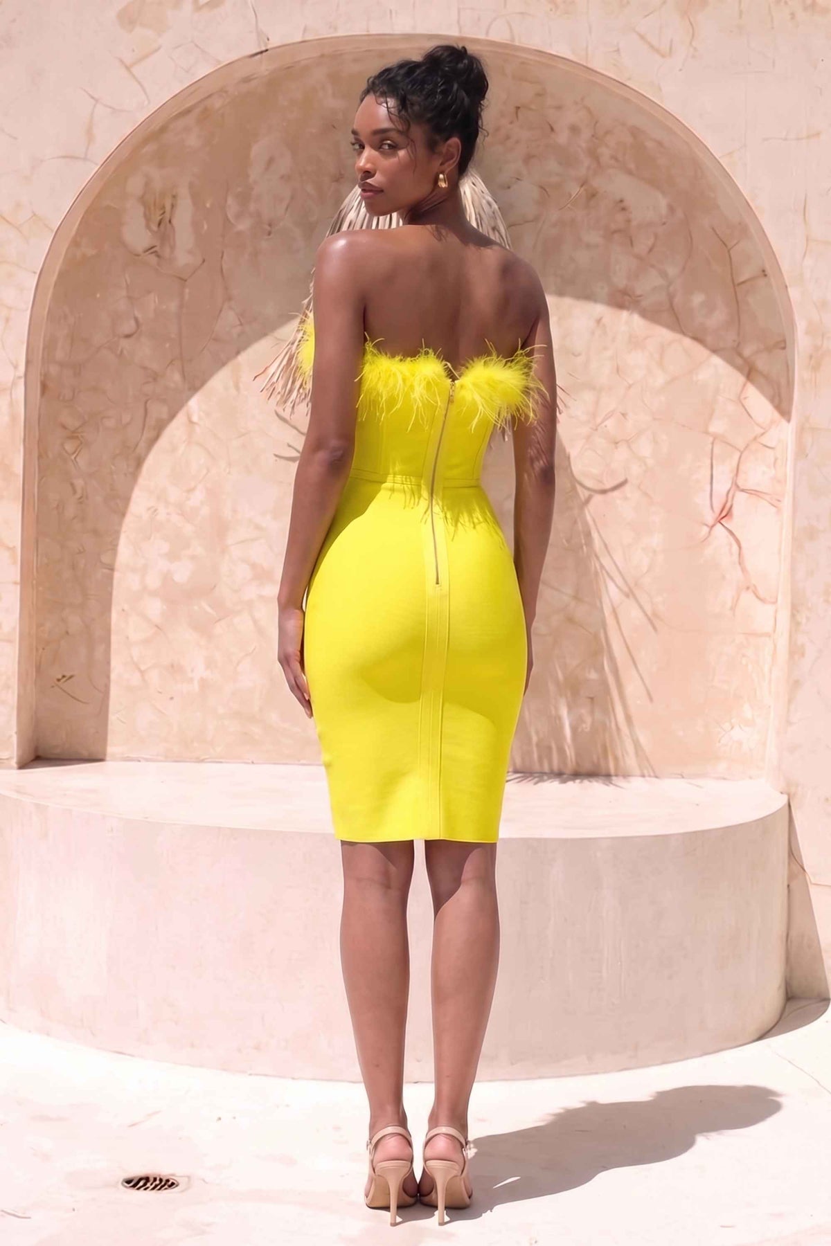Woman wearing a figure flattering  Erin Bandage Dress - Sun Yellow BODYCON COLLECTION