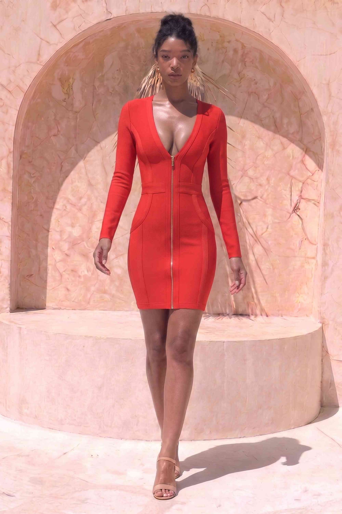 Woman wearing a figure flattering  Eva Long Sleeve Bandage Mini Dress - Lipstick Red BODYCON COLLECTION