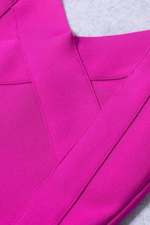 Woman wearing a figure flattering  Freya Bandage Dress - Magenta Pink BODYCON COLLECTION