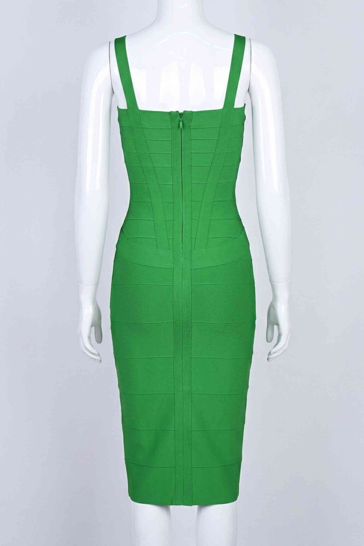 Woman wearing a figure flattering  Heidi Bandage Midi Dress - Emerald Green Bodycon Collection