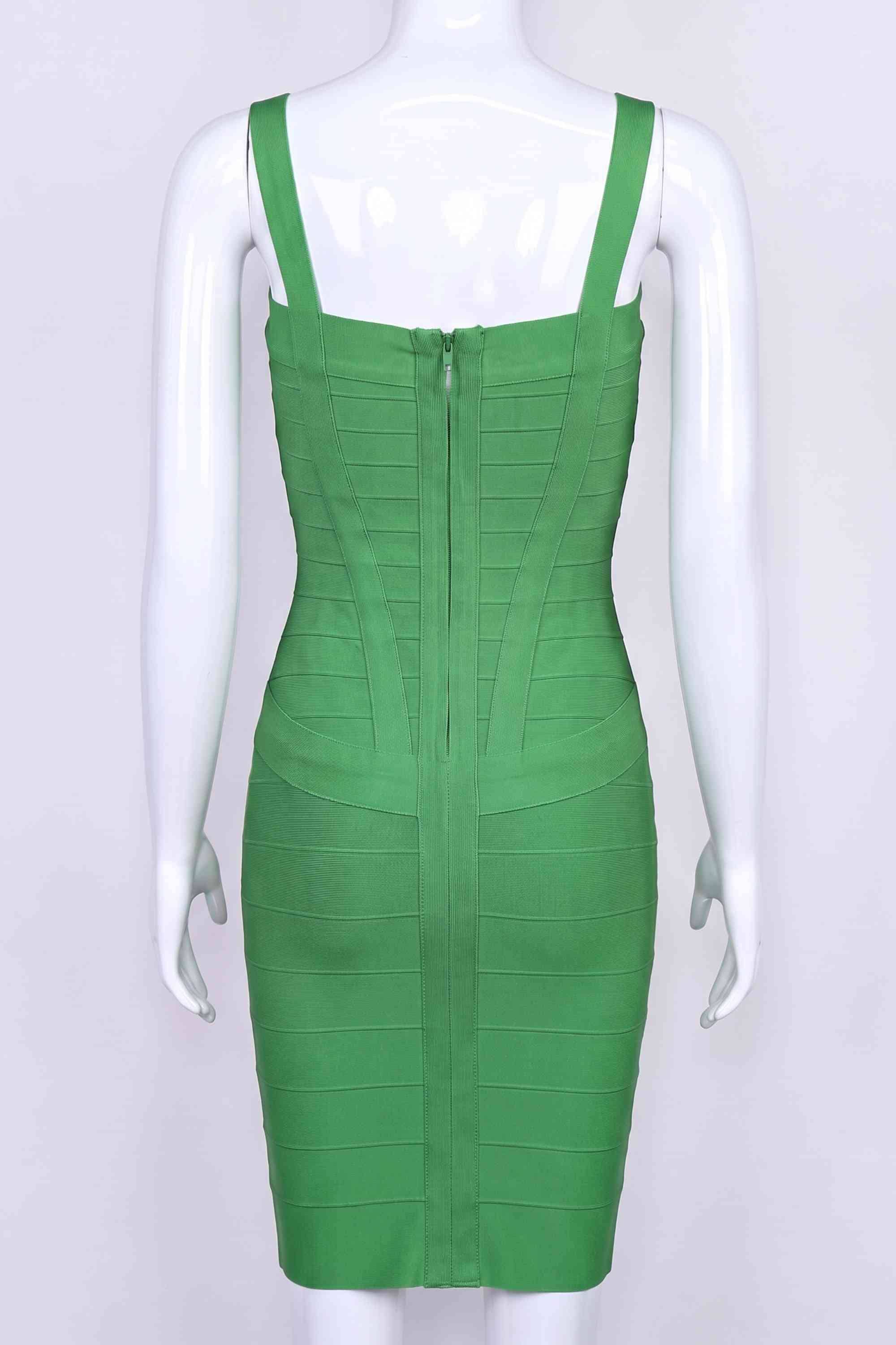 Woman wearing a figure flattering  Heidi Bandage Mini Dress - Emerald Green Bodycon Collection