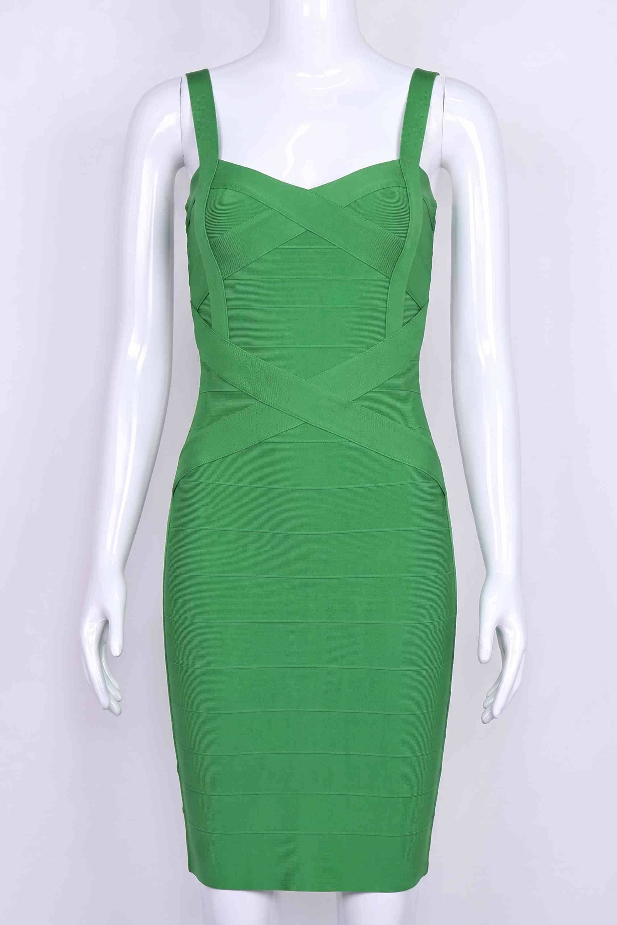 Woman wearing a figure flattering  Heidi Bandage Mini Dress - Emerald Green Bodycon Collection