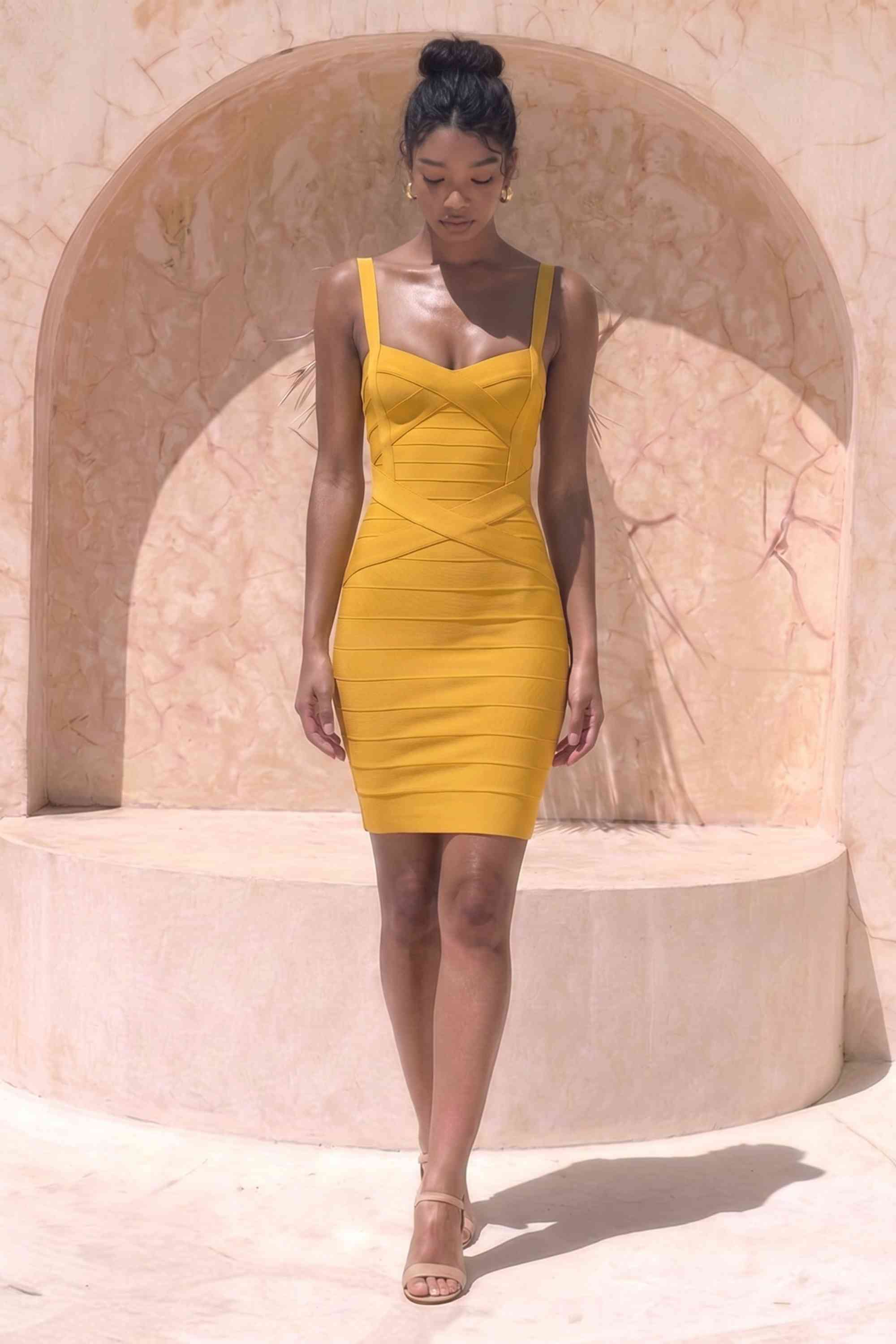 Woman wearing a figure flattering  Heidi Bandage Mini Dress - Mustard Yellow Bodycon Collection