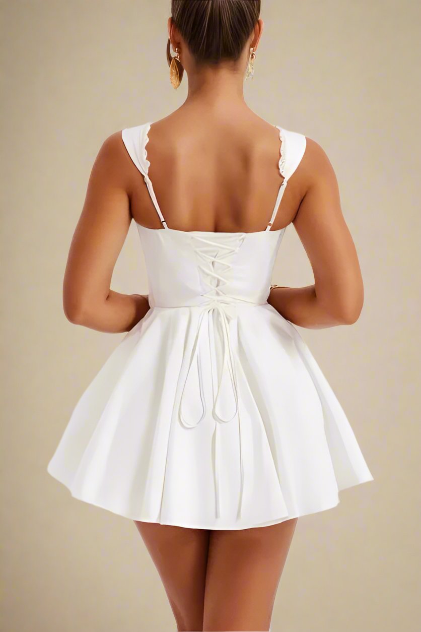 Woman wearing a figure flattering  Adelyn Bodycon Mini Dress - Pearl White BODYCON COLLECTION