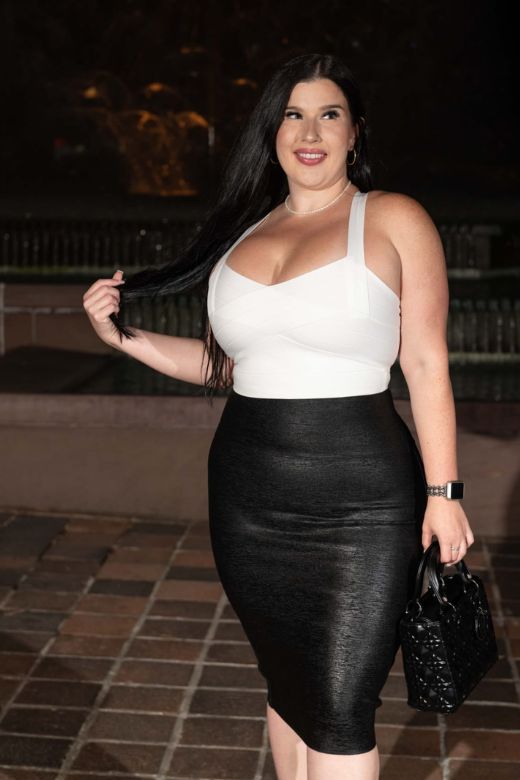 Woman wearing a figure flattering  High Waist Leather Pencil Skirt Midi Length - Metallic Gold BODYCON COLLECTION