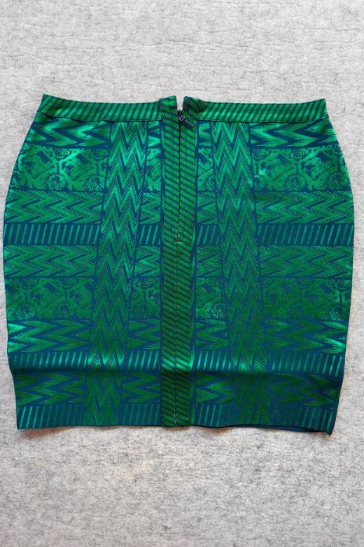 Woman wearing a figure flattering  High Waist Metallic Mini Skirt - Emerald Green BODYCON COLLECTION