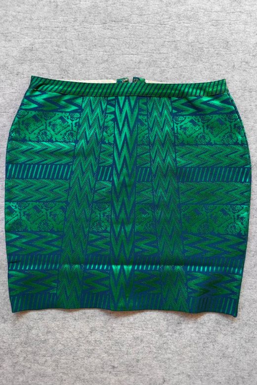 Woman wearing a figure flattering  High Waist Metallic Mini Skirt - Emerald Green BODYCON COLLECTION