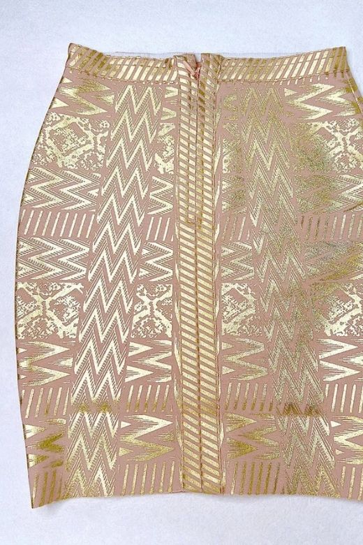 Woman wearing a figure flattering  High Waist Metallic Mini Skirt - Gold BODYCON COLLECTION