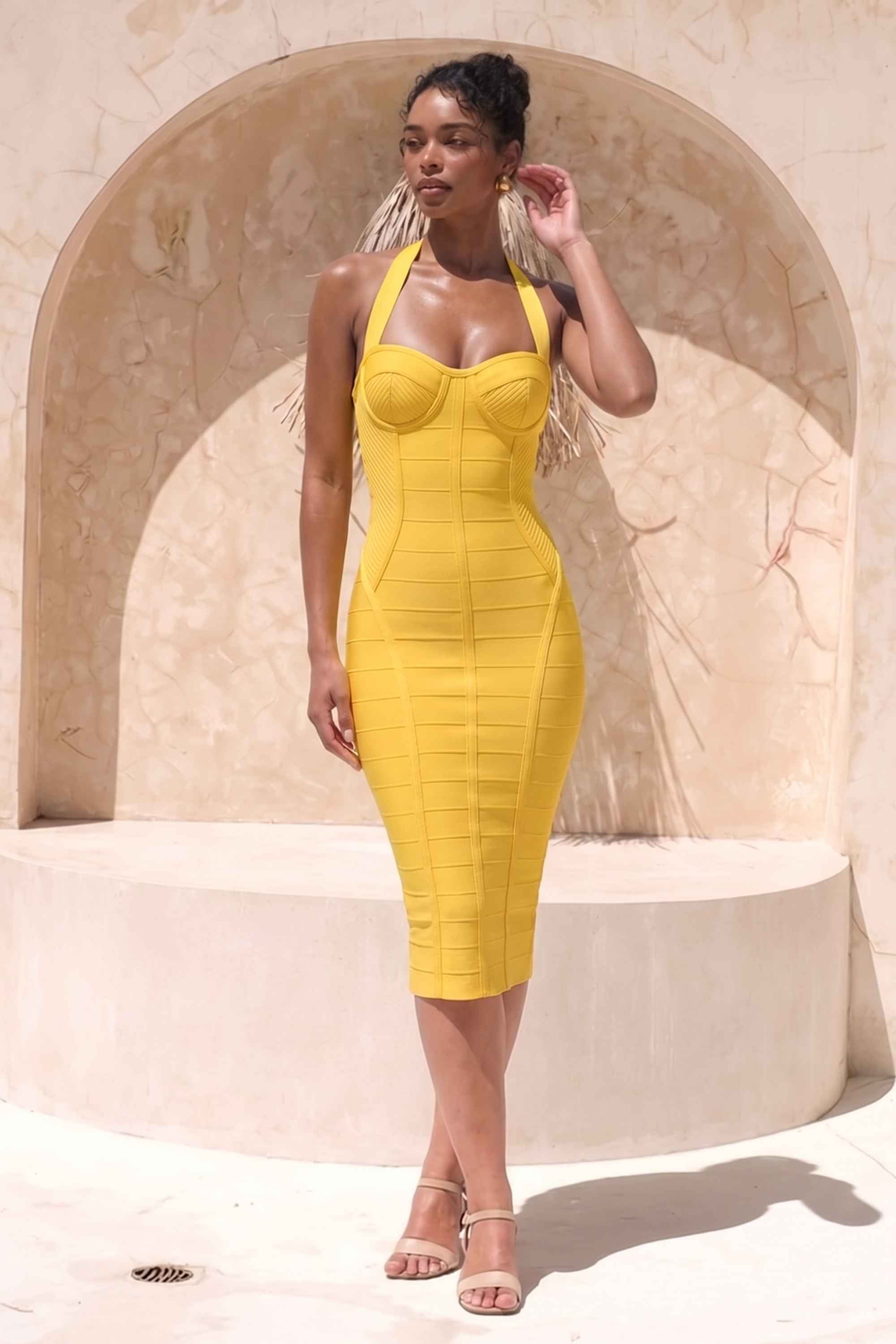 Woman wearing a figure flattering  Isabella Bandage Midi Dress - Mustard Yellow BODYCON COLLECTION Pty Ltd