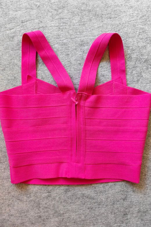 Woman wearing a figure flattering  Jay Bandage Crop Top - Hot Pink BODYCON COLLECTION