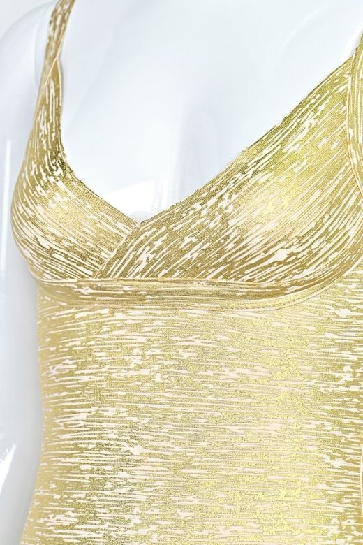 Woman wearing a figure flattering  Kit Bandage Dress - Gold Bodycon Collection