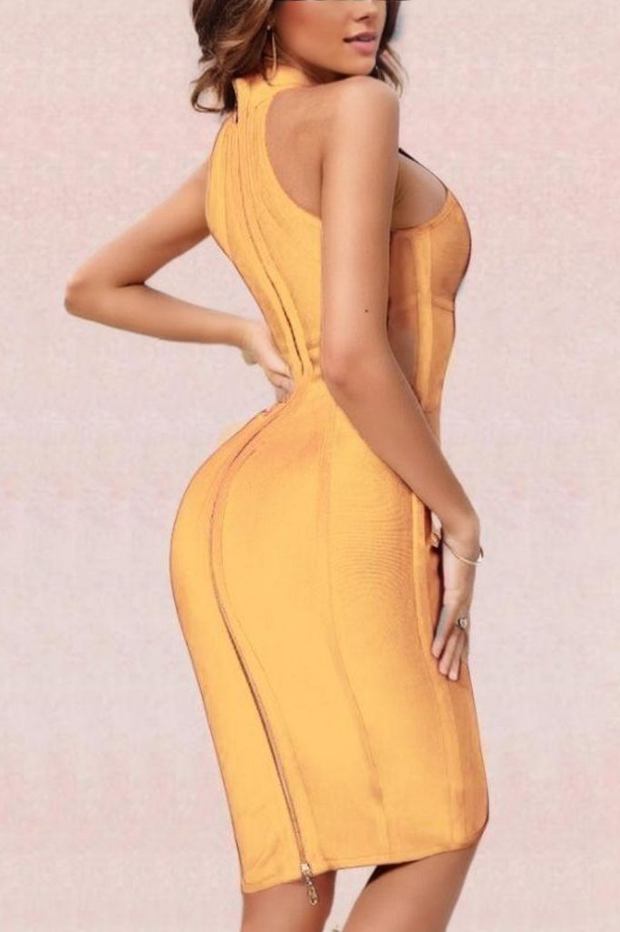 Woman wearing a figure flattering  Lea Bandage Midi Dress - Mustard Yellow Bodycon Collection