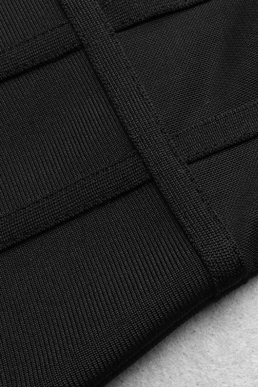 Woman wearing a figure flattering  Leah Bodycon Dress - Classic Black Bodycon Collection