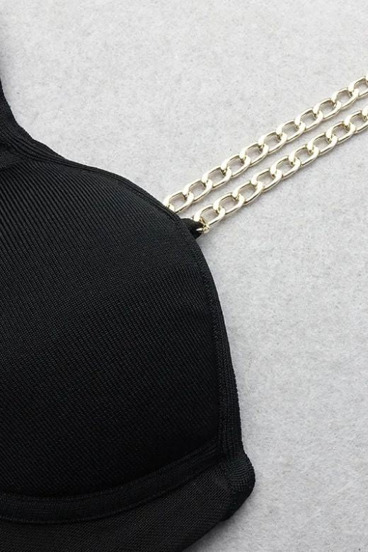 Woman wearing a figure flattering  Leah Bodycon Dress - Classic Black Bodycon Collection