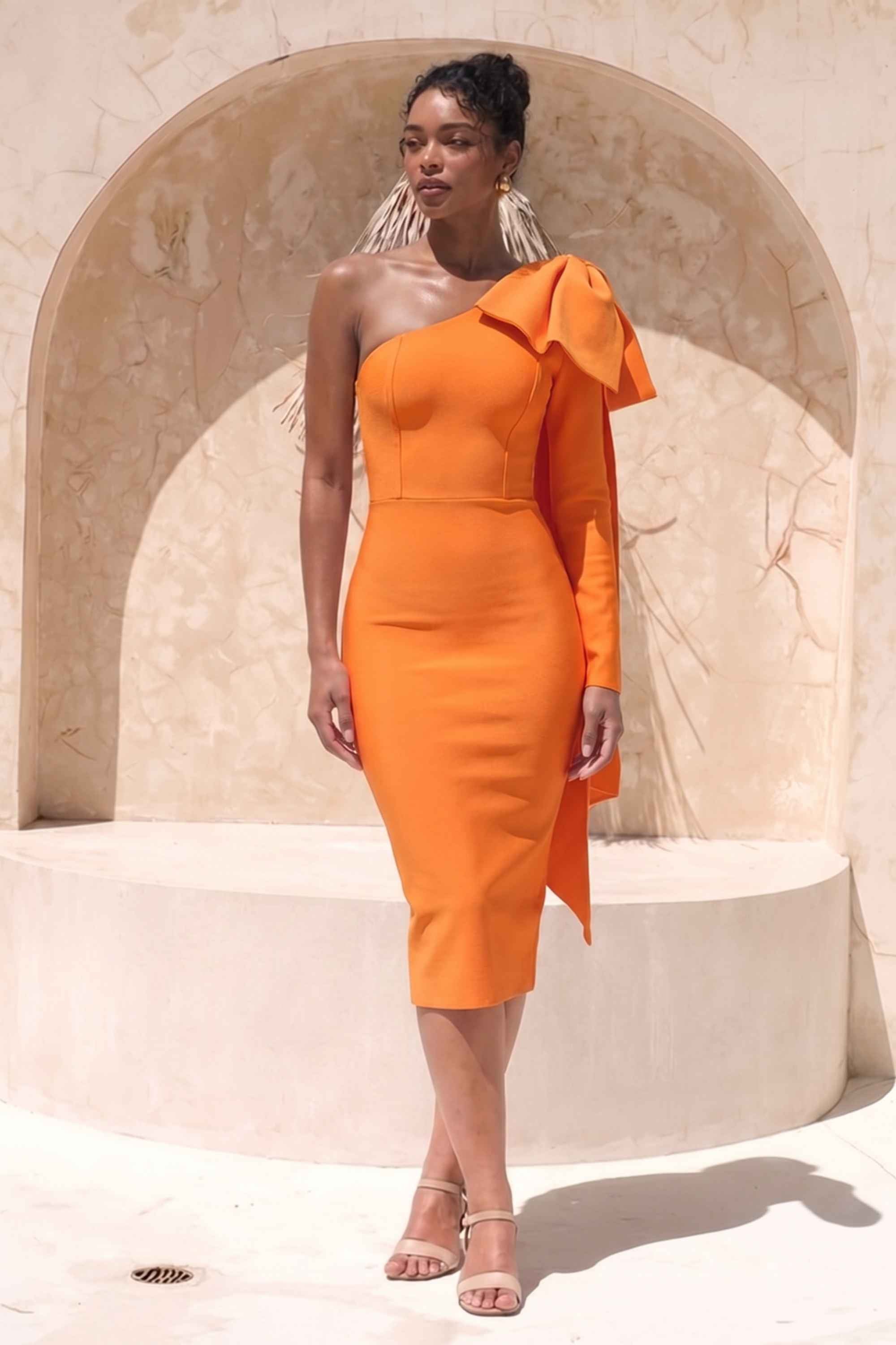 Woman wearing a figure flattering  Lela Long Sleeve Bandage Midi Dress - Apricot Orange BODYCON COLLECTION
