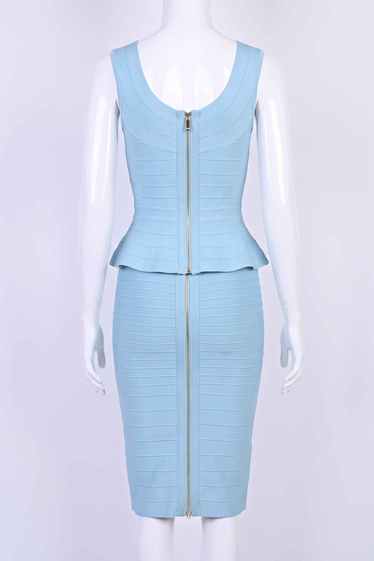 Woman wearing a figure flattering  Leni Bandage Top - Sky Blue BODYCON COLLECTION