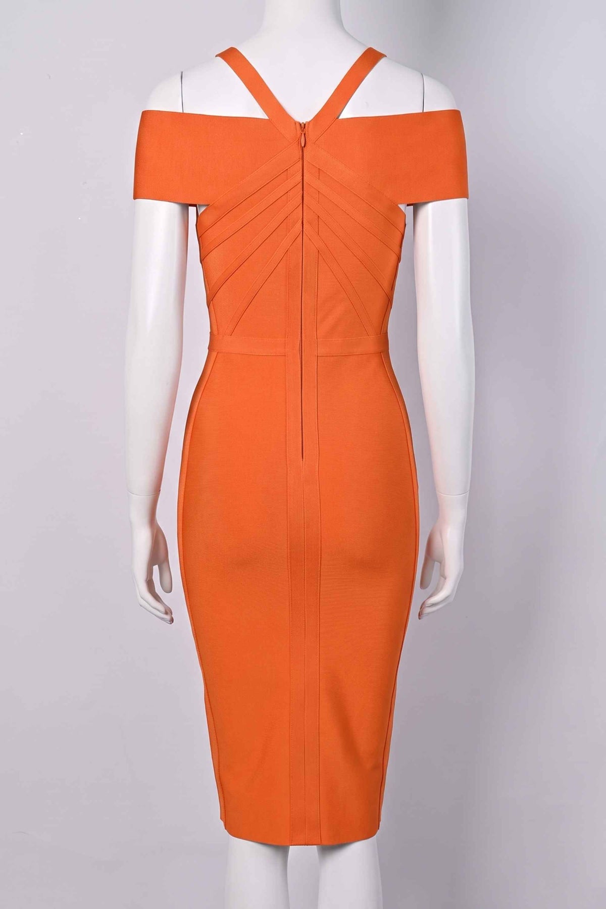 Woman wearing a figure flattering  Leo Bandage Midi Dress - Apricot Orange Bodycon Collection