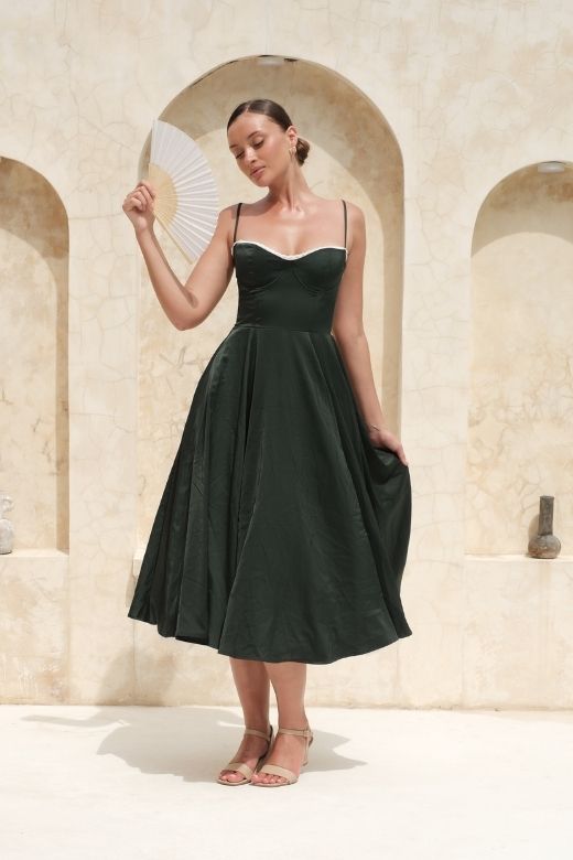 Woman wearing a figure flattering  Mavis Midi Dress - Classic Black BODYCON COLLECTION