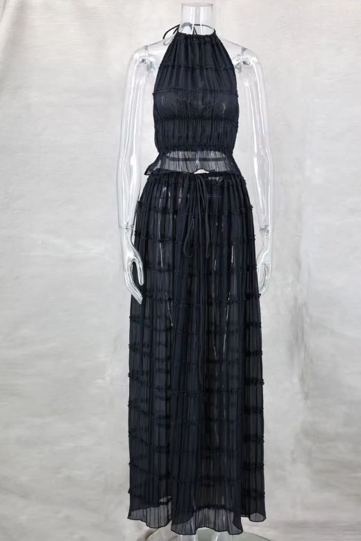 Woman wearing a figure flattering  Meryl Wrap Top and Maxi Skirt Set - Classic Black BODYCON COLLECTION