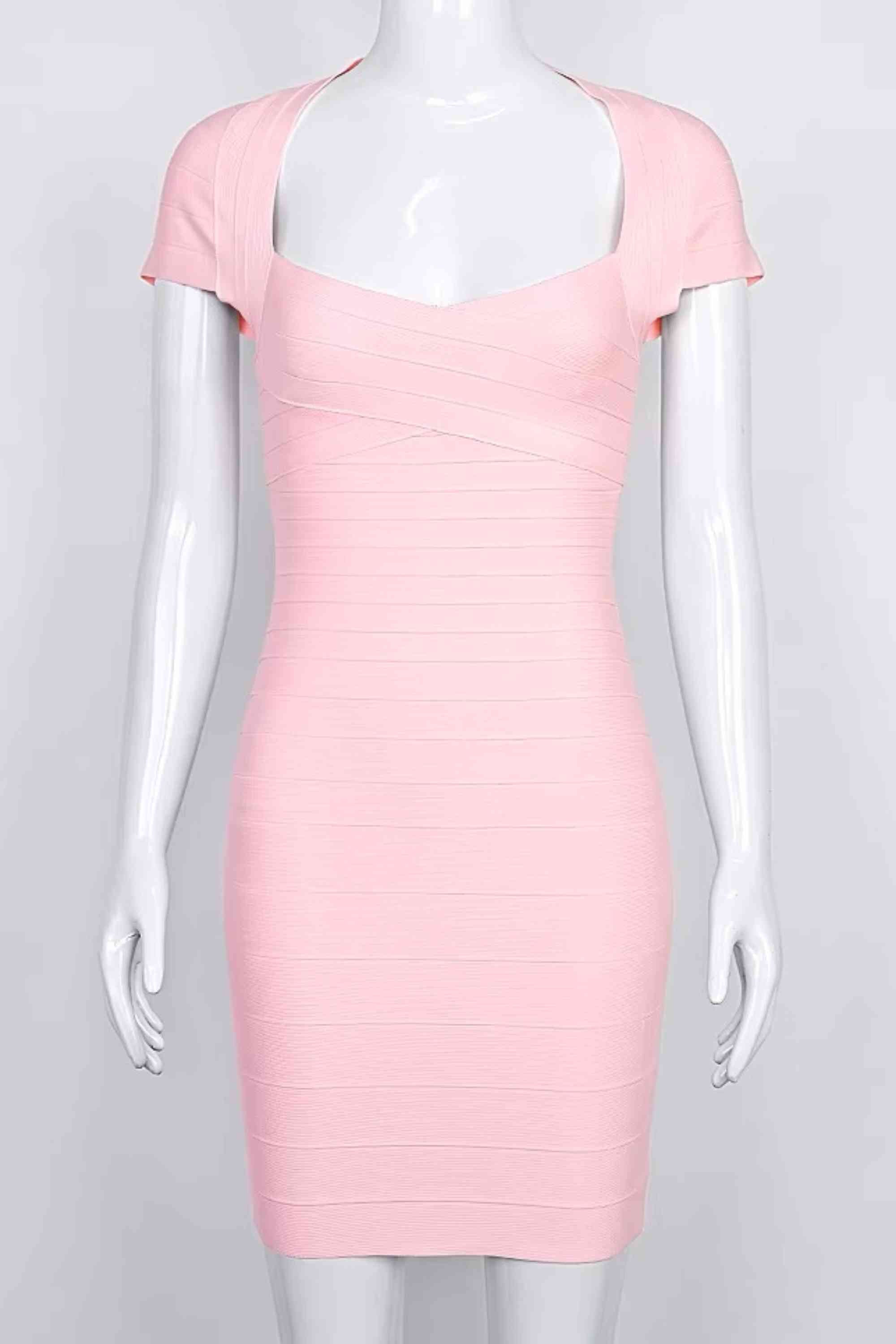 Woman wearing a figure flattering  Miranda Bandage Mini Dress - Dusty Pink Bodycon Collection