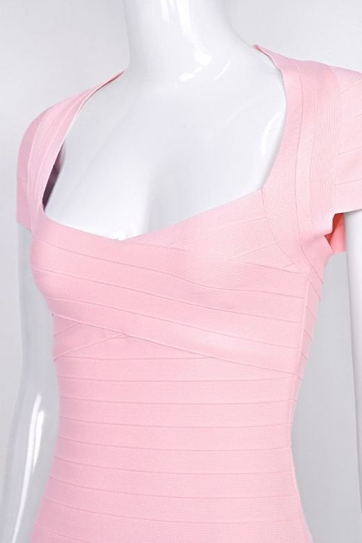 Woman wearing a figure flattering  Miranda Bandage Mini Dress - Dusty Pink Bodycon Collection