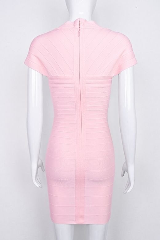 Woman wearing a figure flattering  Miranda Bandage Mini Dress - Dusty Pink Bodycon Collection