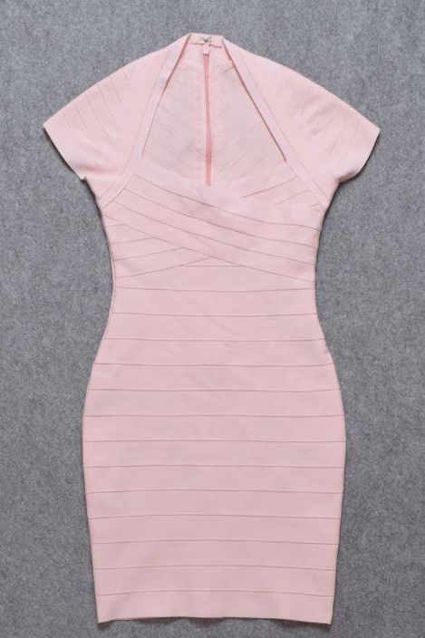 Woman wearing a figure flattering  Miranda Bandage Mini Dress - Dusty Pink Bodycon Collection