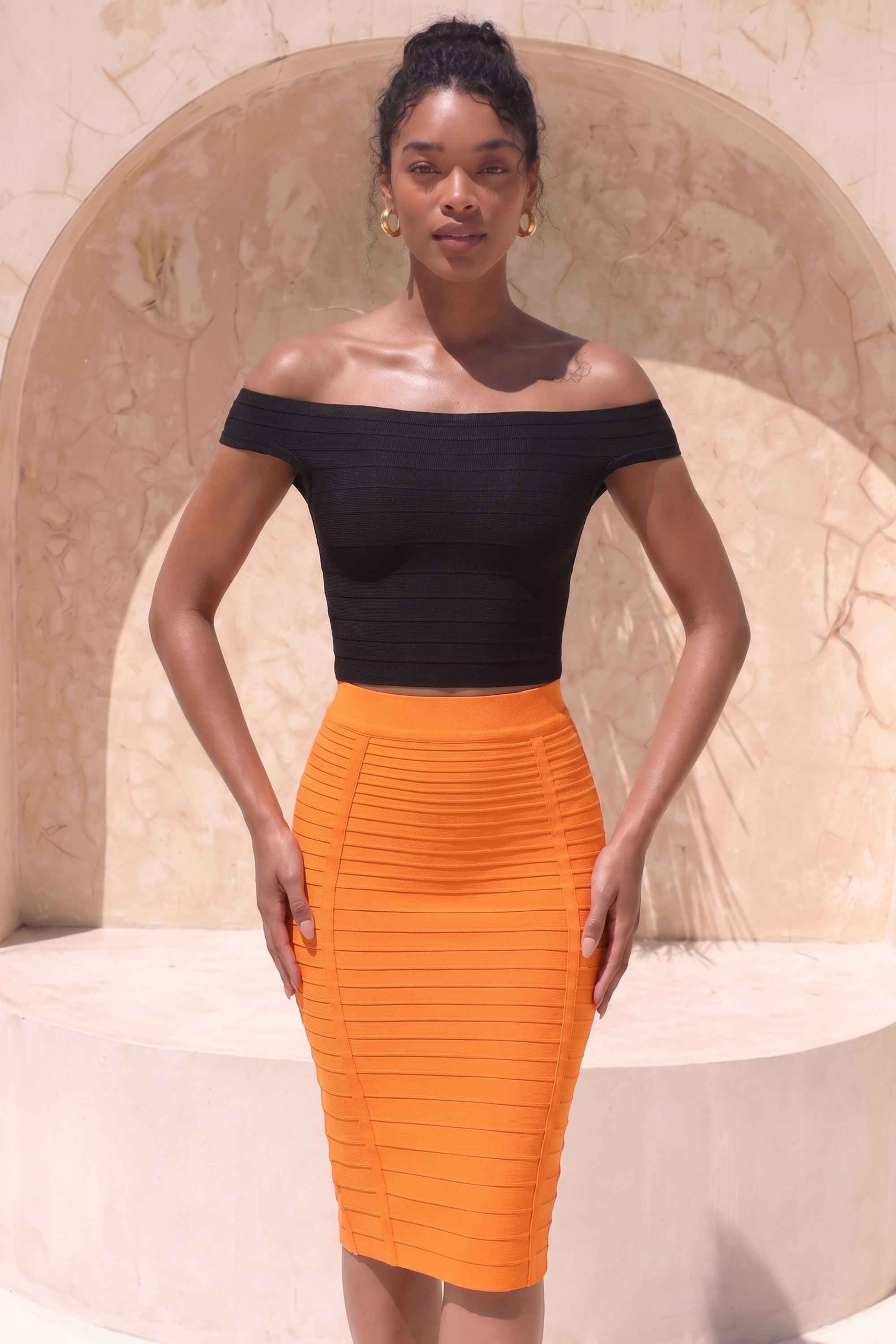 Woman wearing a figure flattering  Pencil High Waist Bandage Knee Length Knitted Skirt - Apricot Orange BODYCON COLLECTION