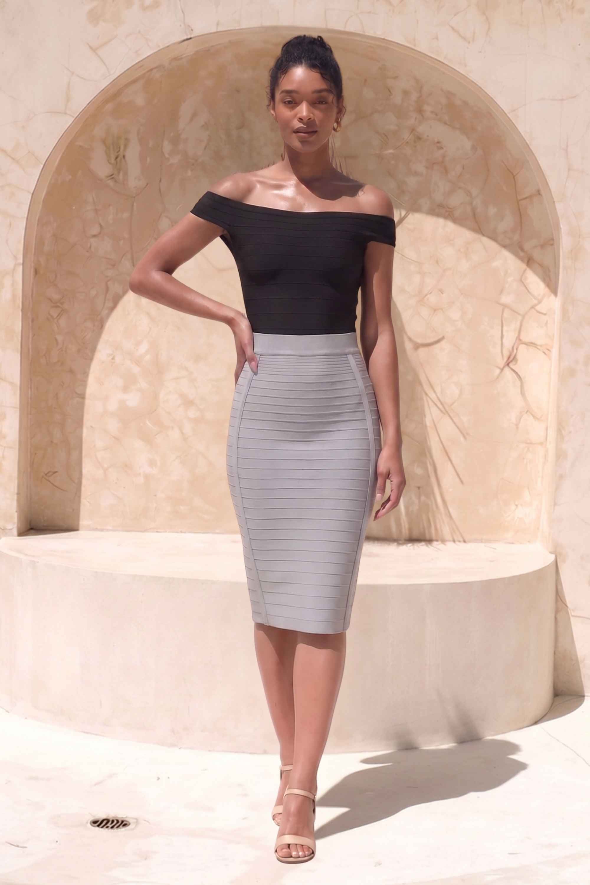 Woman wearing a figure flattering  Pencil High Waist Bandage Knee Length Knitted Skirt - Steel Grey BODYCON COLLECTION