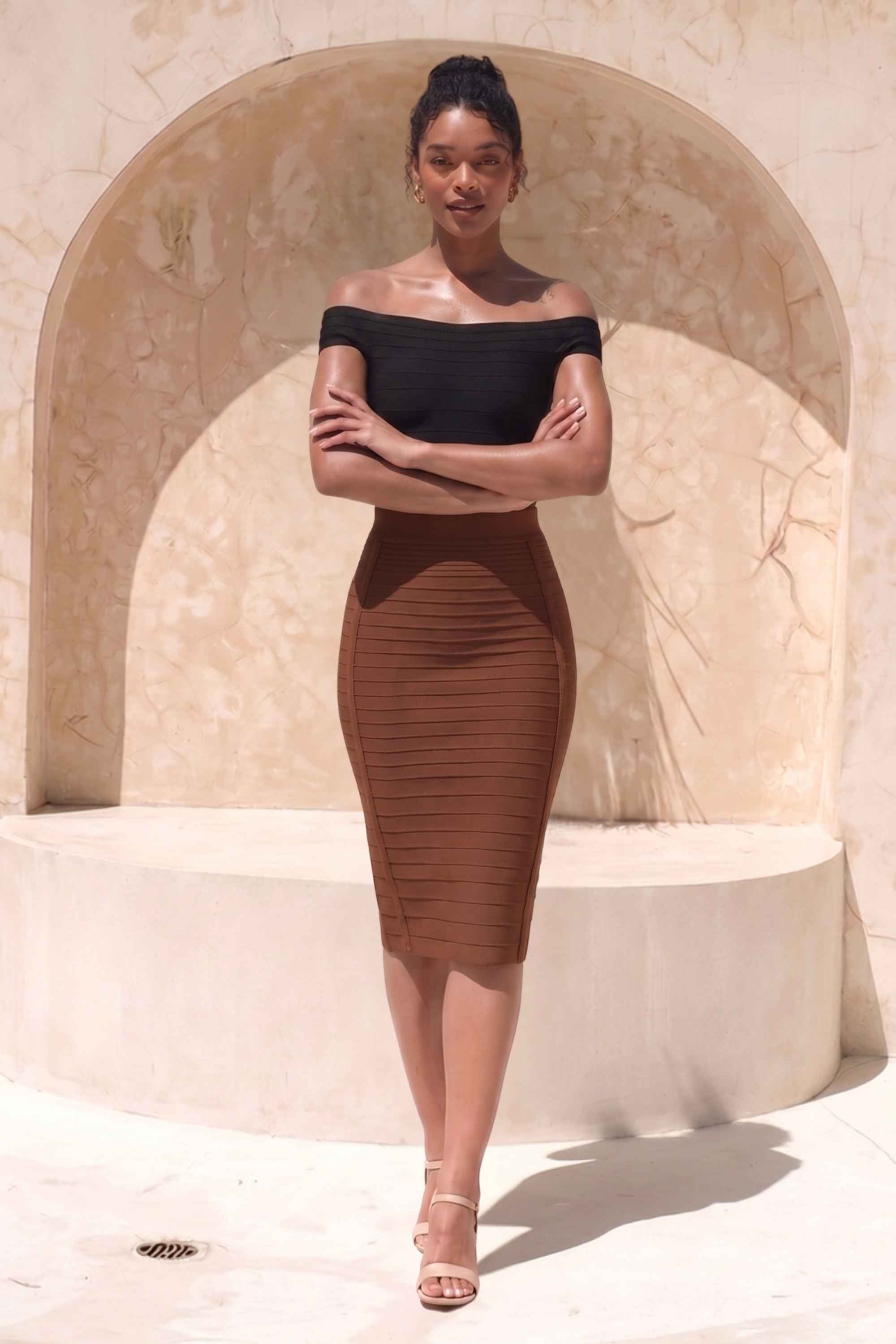 Woman wearing a figure flattering  Pencil High Waist Bandage Knee Length Knitted Skirt - Tan Brown BODYCON COLLECTION