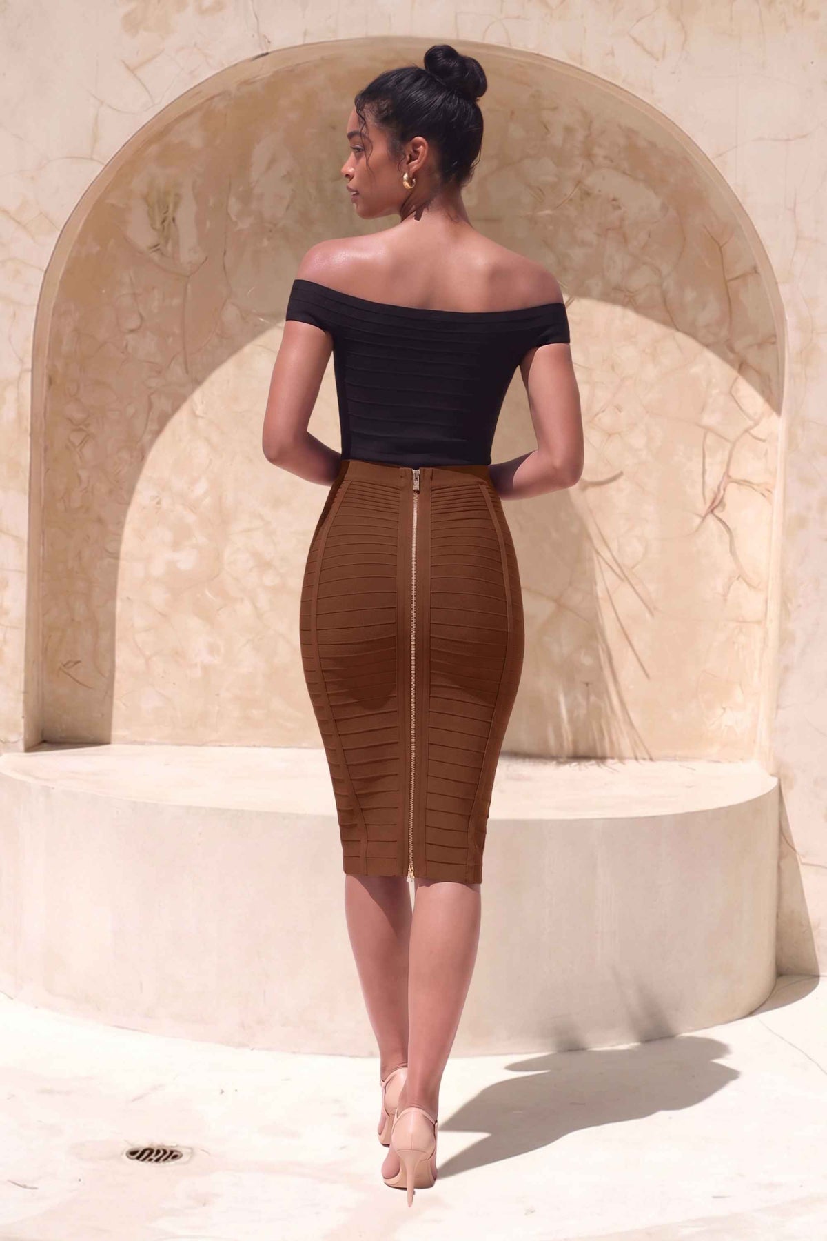 Woman wearing a figure flattering  Pencil High Waist Bandage Knee Length Knitted Skirt - Tan Brown BODYCON COLLECTION