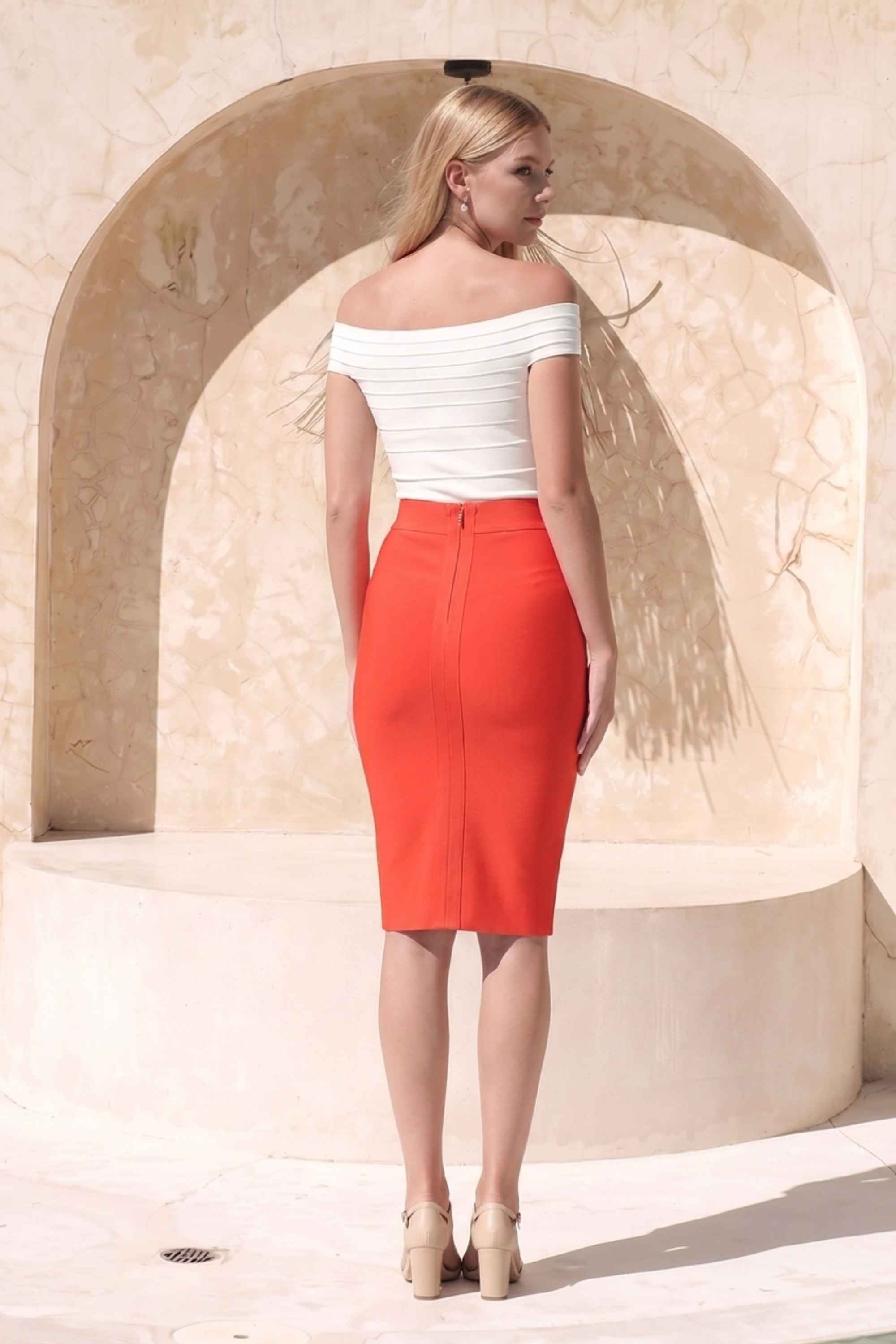 Woman wearing a figure flattering  Pencil High Waist Bandage Knee Length Skirt - Lipstick Red BODYCON COLLECTION